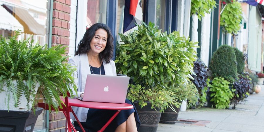 Rachel Frentsos writing a blog article in downtown Annapolis