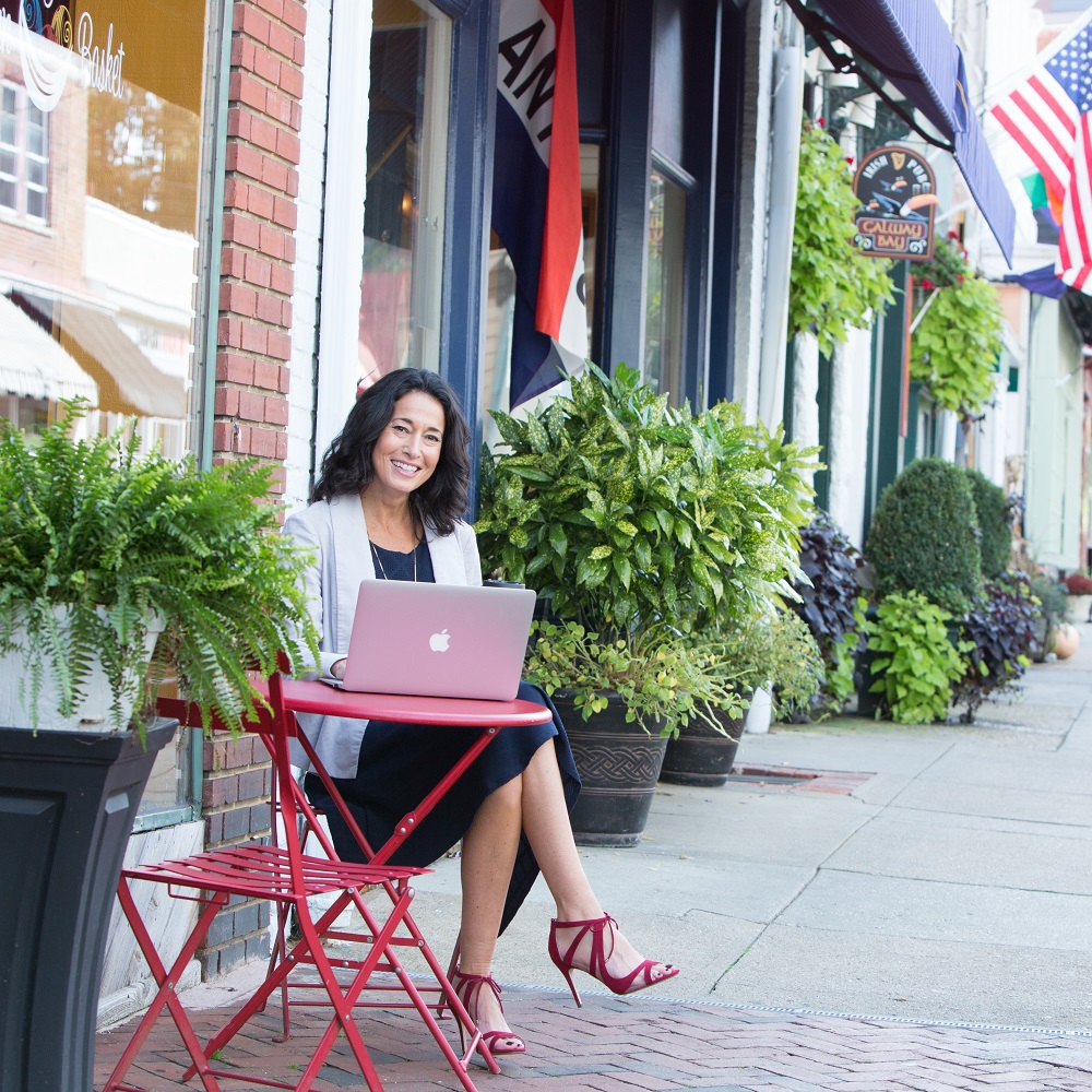 Rachel Frentsos writing a blog article in downtown Annapolis